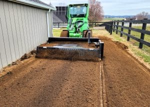 avant tractor with skid steer rock rake attachment by ideal rockaway