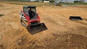 rockaway skid steer land rake skeleton bucket on job site
