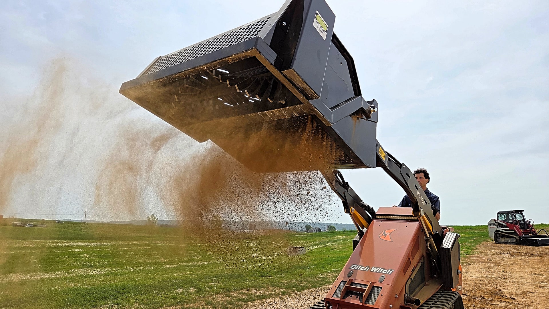 mini-skid-steer-landscape-rake-with-screening-bucket-rockaway-landscape-rake